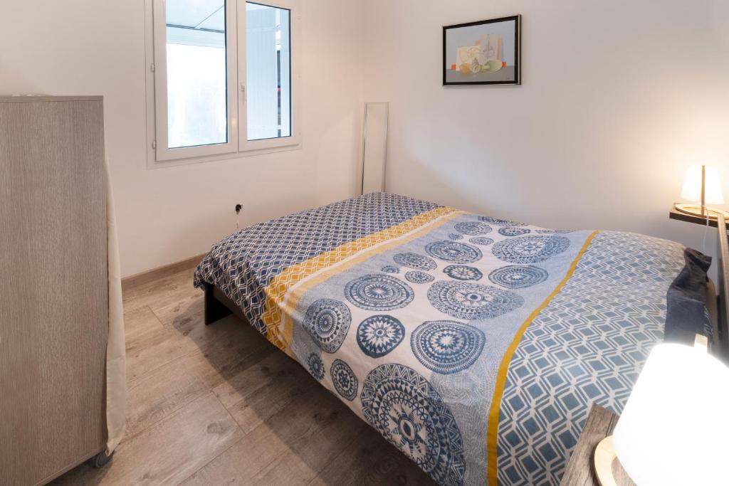 Postel nebo postele na pokoji v ubytování La Cotinette