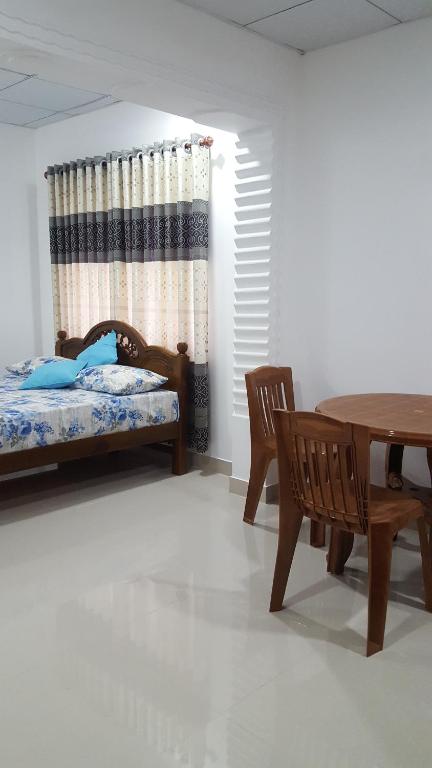 Postel nebo postele na pokoji v ubytování Anura Home Stay