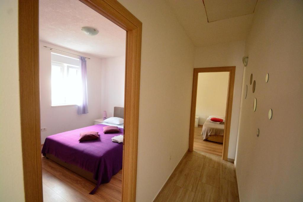 Posteľ alebo postele v izbe v ubytovaní Kala and Tina apartments