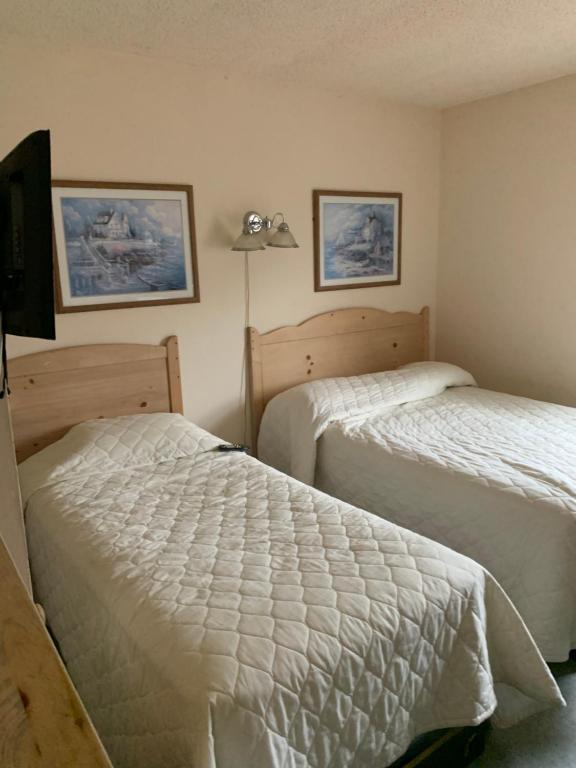 Postel nebo postele na pokoji v ubytování Summer Place Hotel
