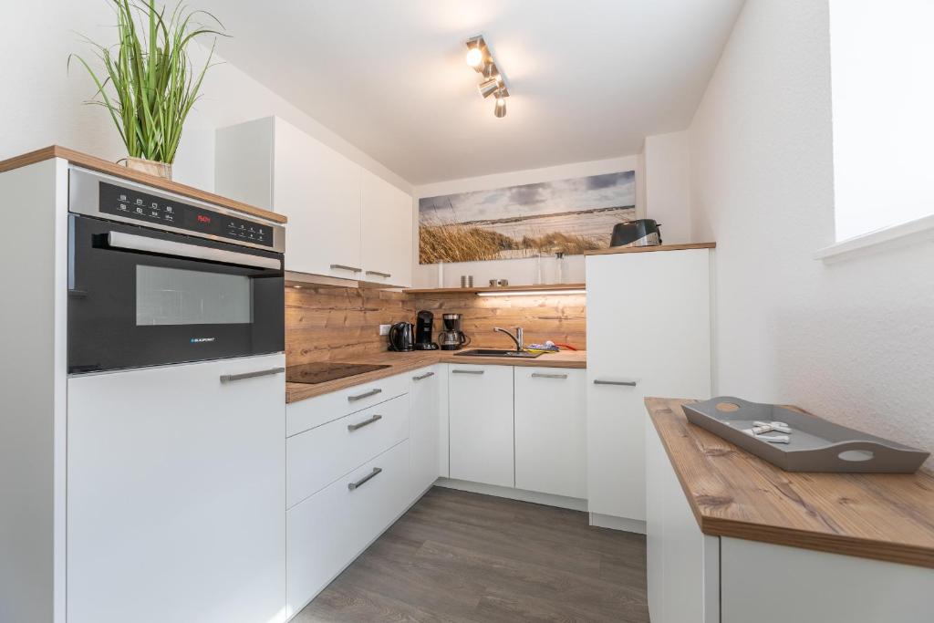Kuchyň nebo kuchyňský kout v ubytování Haus Inselanker Kajüte 10