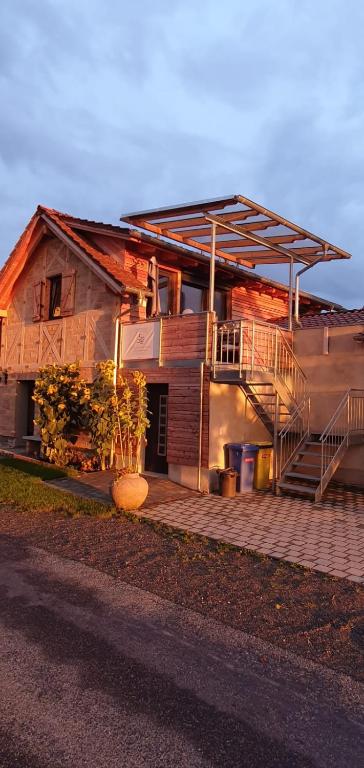 a house with a staircase in front of it at Zettis Ferienhäusle in Berg bei Ravensburg