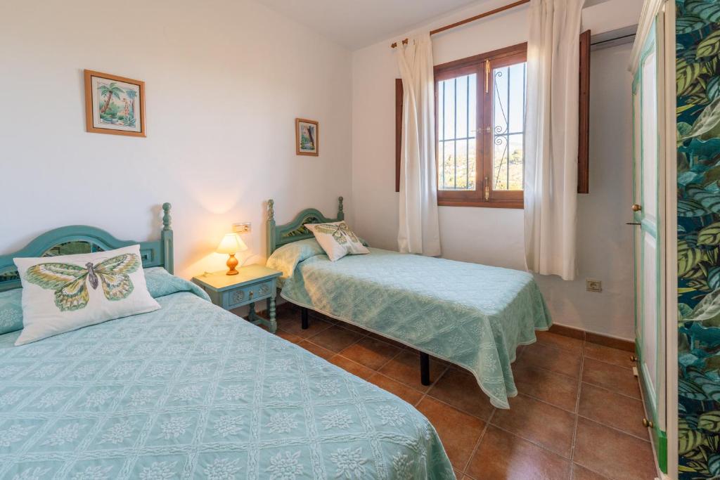 Postel nebo postele na pokoji v ubytování Villa Tropicana
