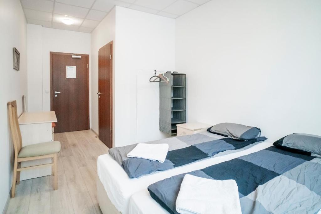 Rúm í herbergi á Guesthouse Pavi