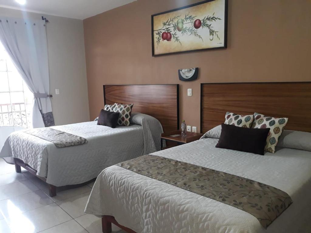 Postel nebo postele na pokoji v ubytování Hotel el Leñador