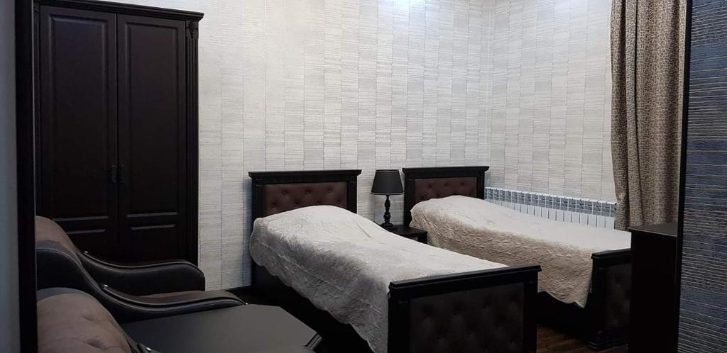 Postel nebo postele na pokoji v ubytování Ahana Hotel
