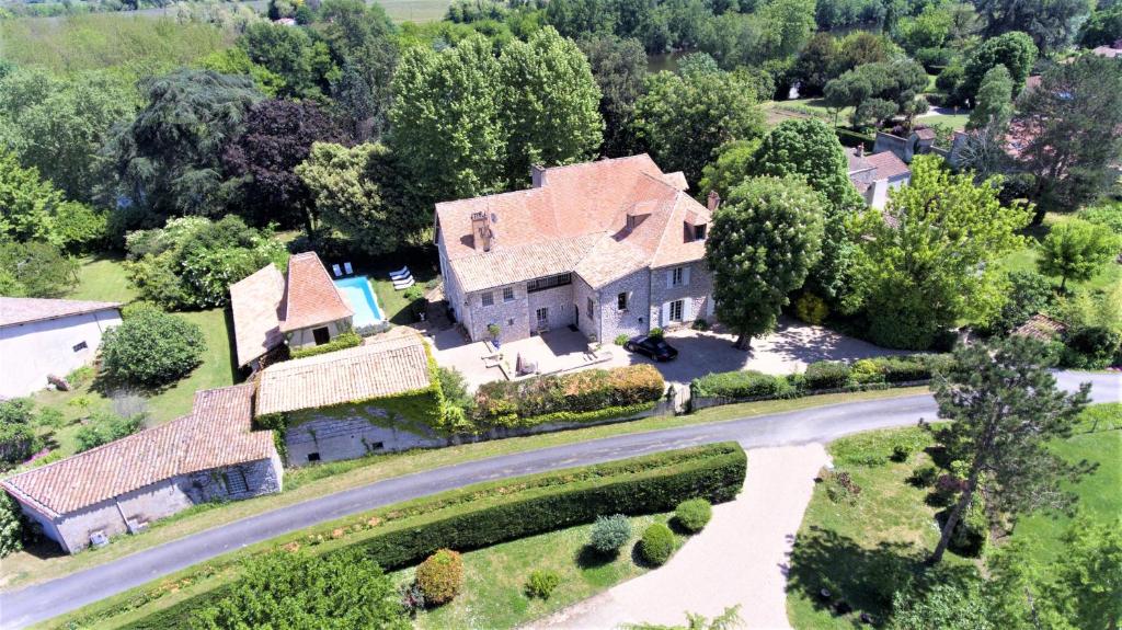 an aerial view of a house with a road at Manoir du Bois Mignon in Le Fleix