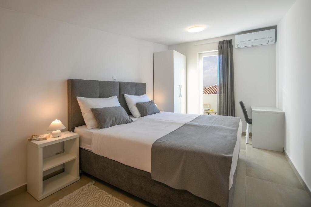 Posteľ alebo postele v izbe v ubytovaní A&V Residence