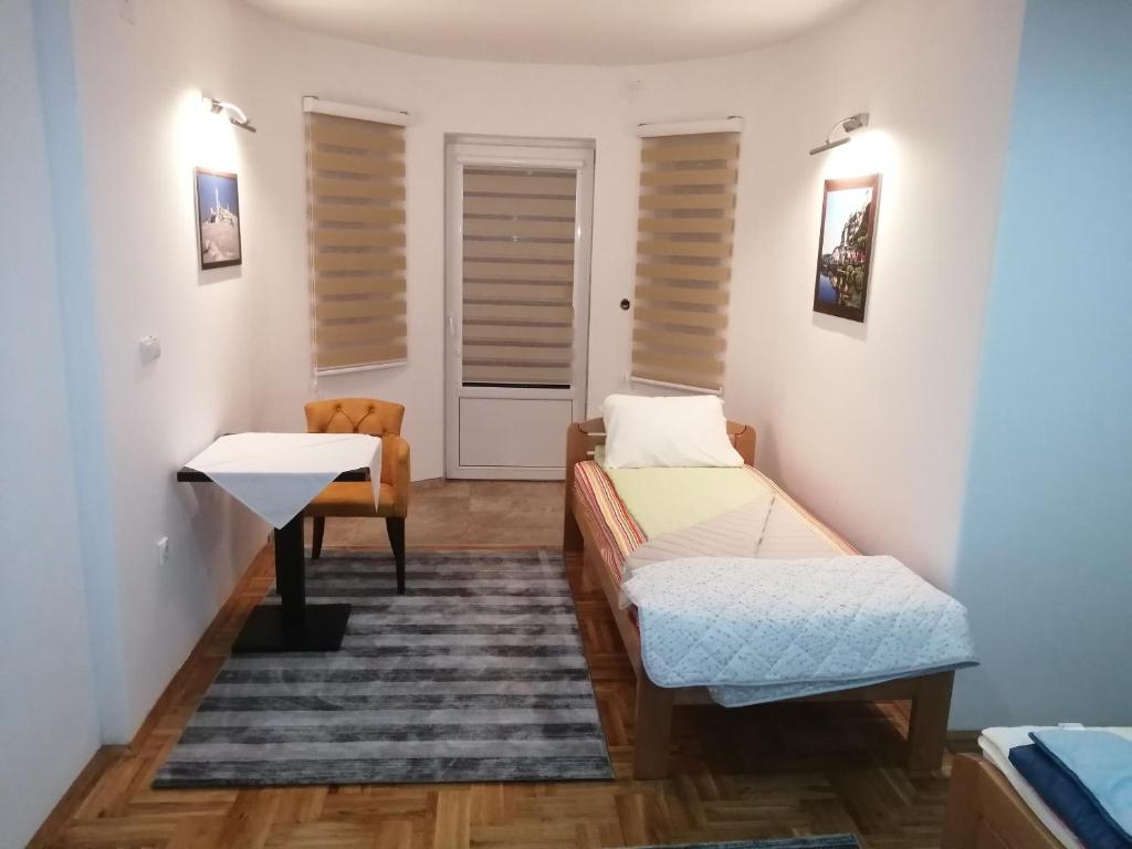 Postel nebo postele na pokoji v ubytování ORTODOKS