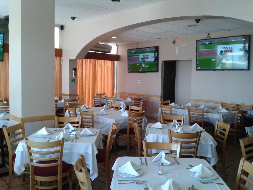 TV a/nebo společenská místnost v ubytování Hotel Real del Mar