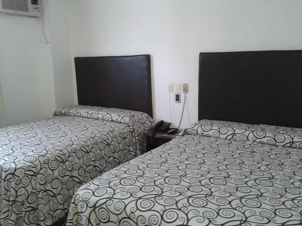 Postel nebo postele na pokoji v ubytování Hotel Real del Mar