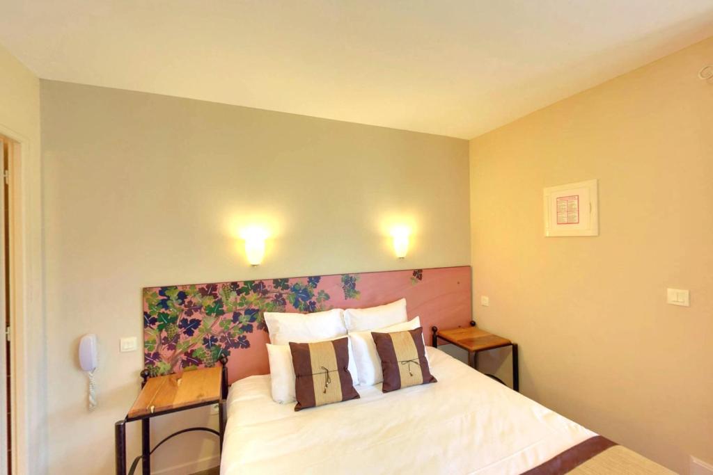 Postel nebo postele na pokoji v ubytování Hotel du Mas