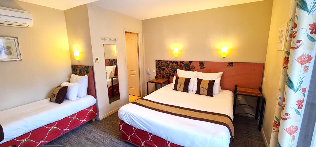 Postel nebo postele na pokoji v ubytování Hotel du Mas