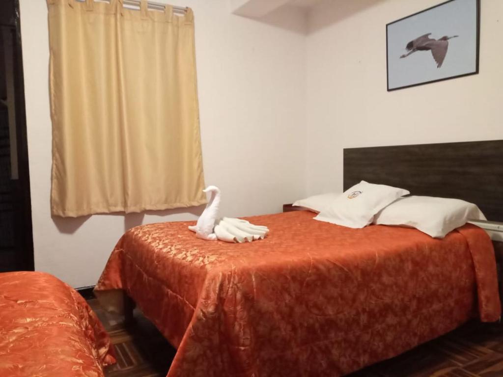Ένα ή περισσότερα κρεβάτια σε δωμάτιο στο Qoricancha B&B Cusco