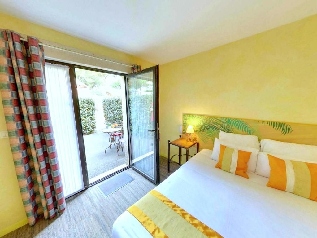 Postel nebo postele na pokoji v ubytování Hotel du Mas