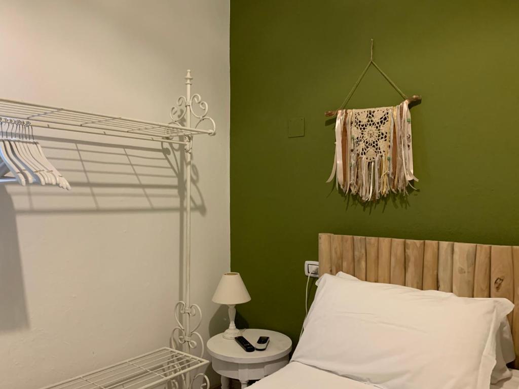 Postel nebo postele na pokoji v ubytování AGRIB&B Il Pomo d'oro