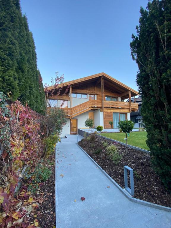 a house with a walkway in front of it at Living8-Appartements in Bad Ischl