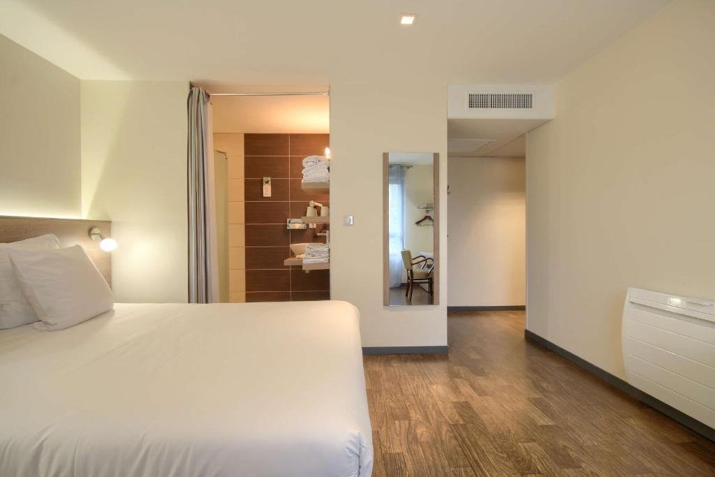 Postel nebo postele na pokoji v ubytování Sure Hotel by Best Western Reims Nord