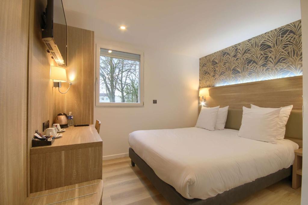 Postel nebo postele na pokoji v ubytování Sure Hotel by Best Western Reims Nord