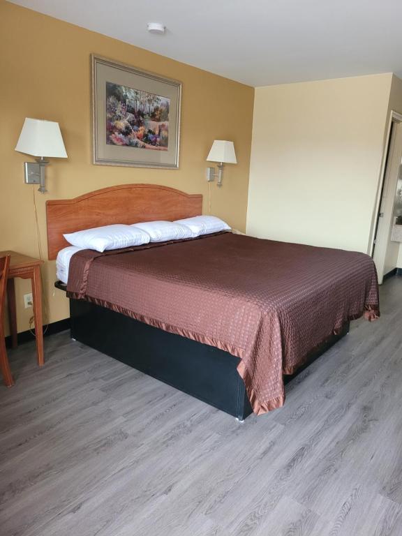 Ένα ή περισσότερα κρεβάτια σε δωμάτιο στο Stay Inn Checotah
