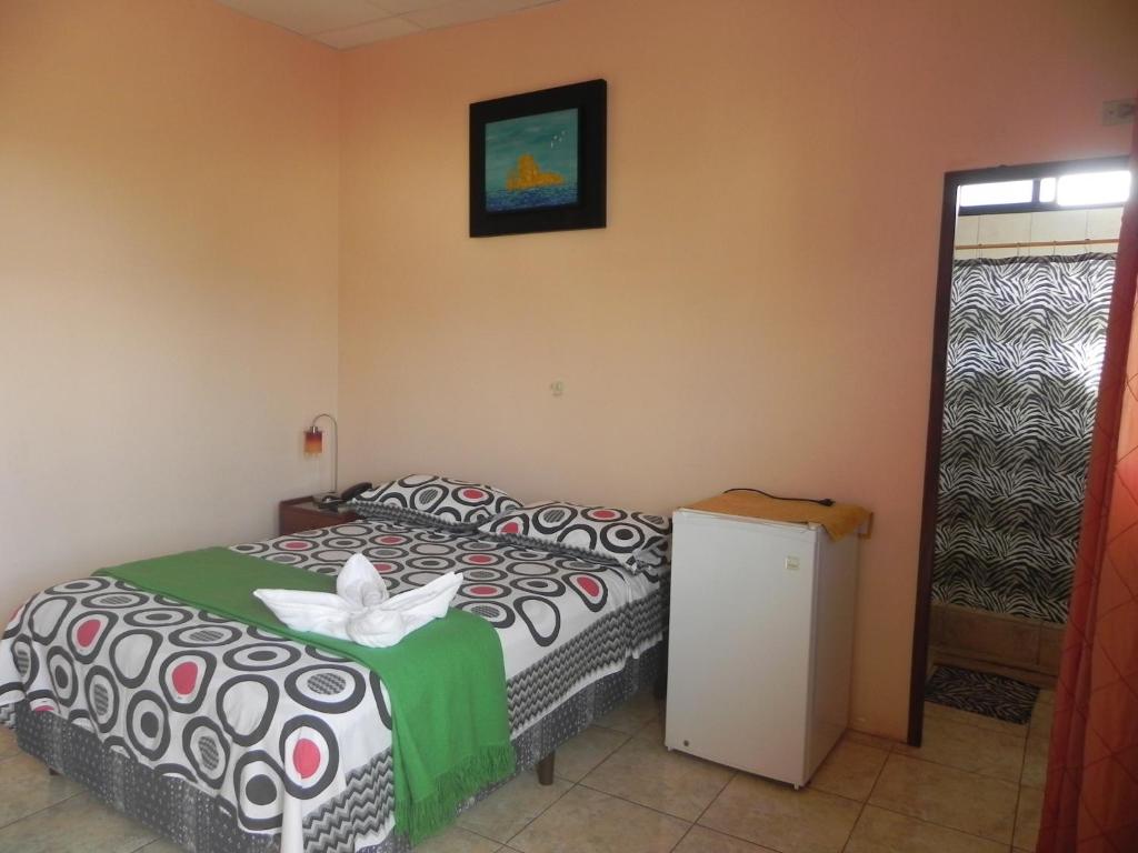 Postel nebo postele na pokoji v ubytování Hostal La Posada De Jose Carlos