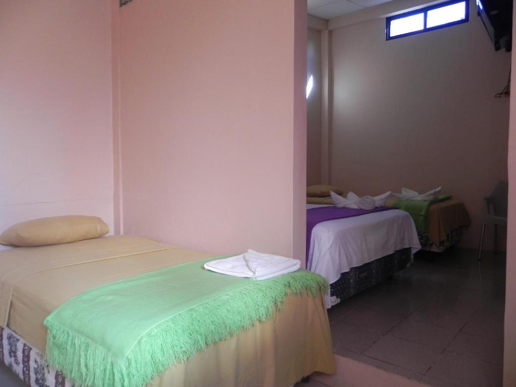 Postel nebo postele na pokoji v ubytování Hostal La Posada De Jose Carlos
