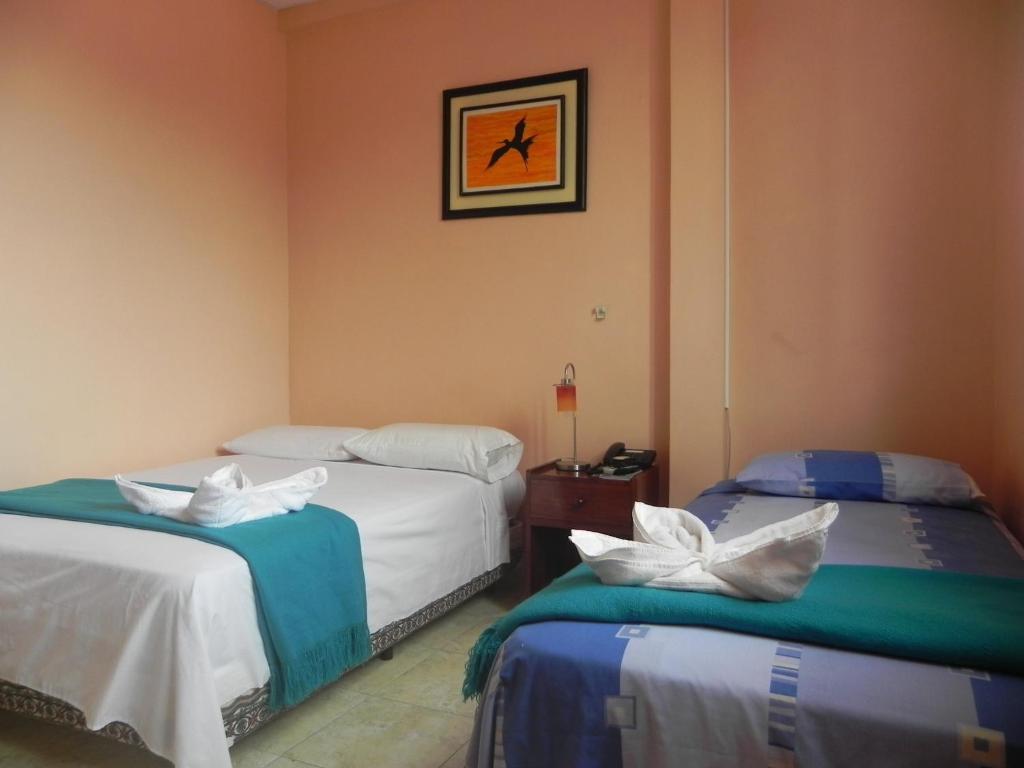 Postel nebo postele na pokoji v ubytování Hostal La Posada De Jose Carlos