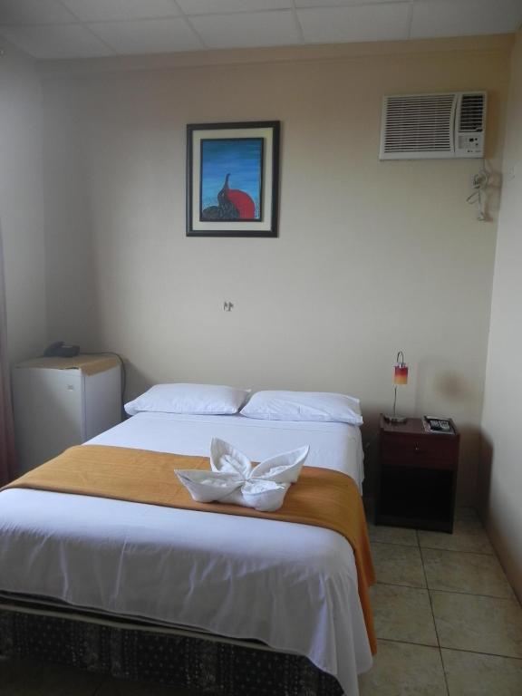 Postel nebo postele na pokoji v ubytování Hostal La Posada De Jose Carlos