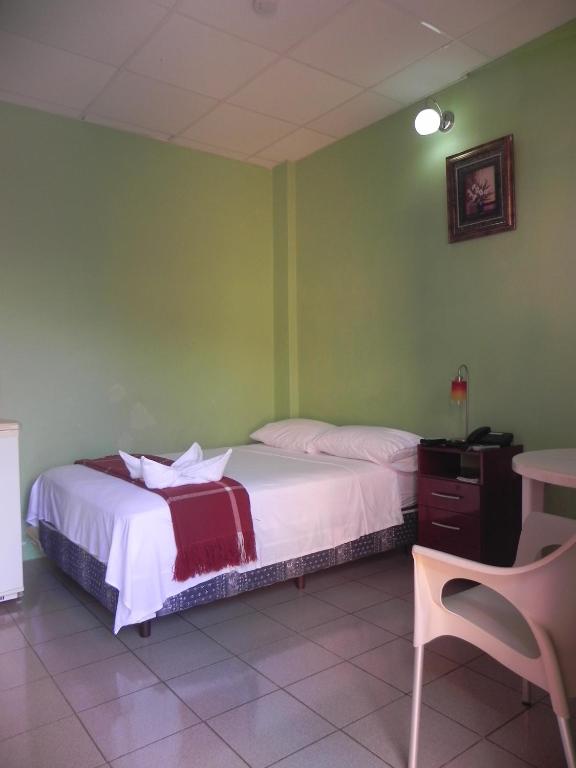 Postel nebo postele na pokoji v ubytování Hostal La Posada De Jose Carlos