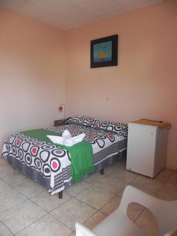 Postel nebo postele na pokoji v ubytování Hostal La Posada De Jose Carlos