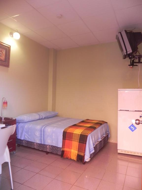 Postel nebo postele na pokoji v ubytování Hostal La Posada De Jose Carlos