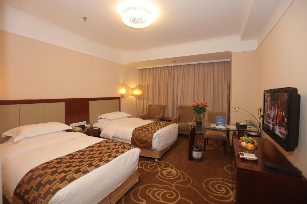Postel nebo postele na pokoji v ubytování Inner Mongolia Grand Hotel