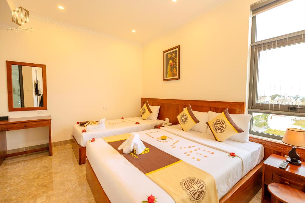 Giường trong phòng chung tại Thọ Hướng Hotel - Phan Thiết