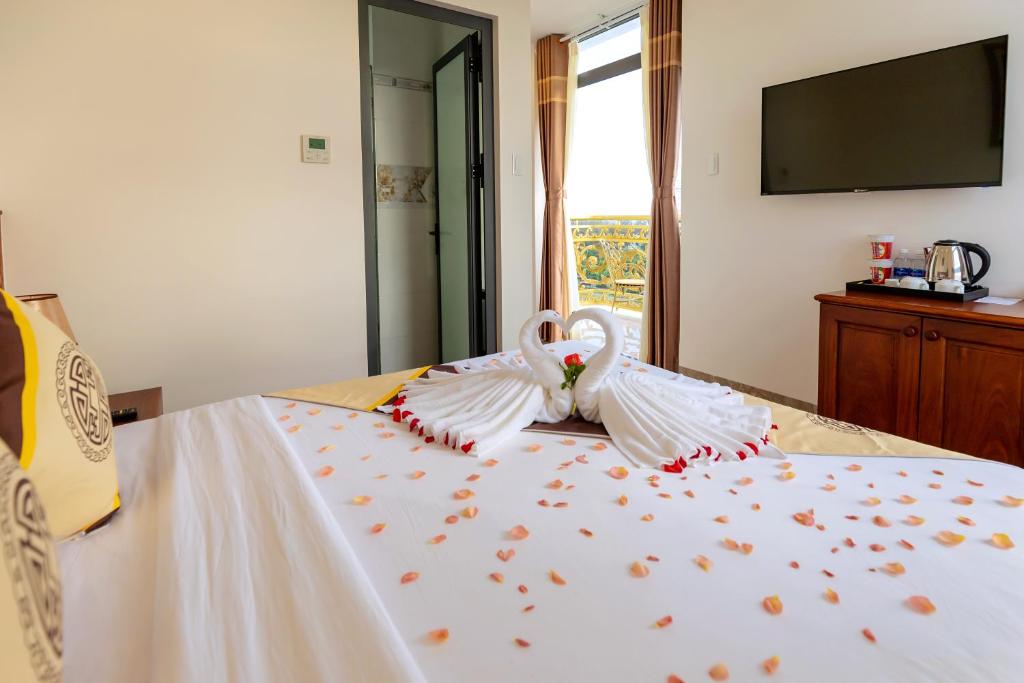 Giường trong phòng chung tại Thọ Hướng Hotel - Phan Thiết