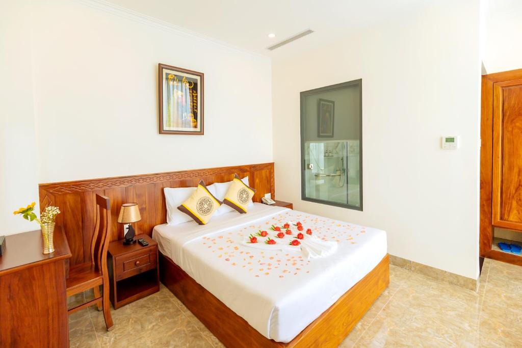Giường trong phòng chung tại Thọ Hướng Hotel - Phan Thiết