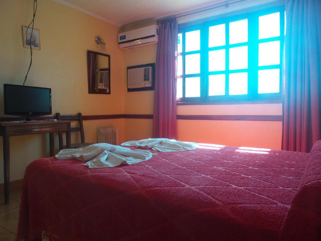 Postel nebo postele na pokoji v ubytování Hosteria Los Helechos