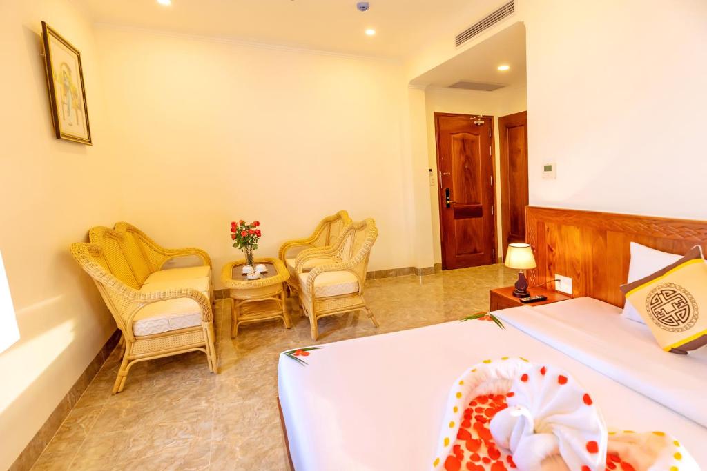 Giường trong phòng chung tại Thọ Hướng Hotel - Phan Thiết