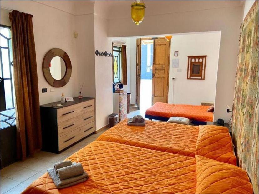Łóżko lub łóżka w pokoju w obiekcie Casa di Marco