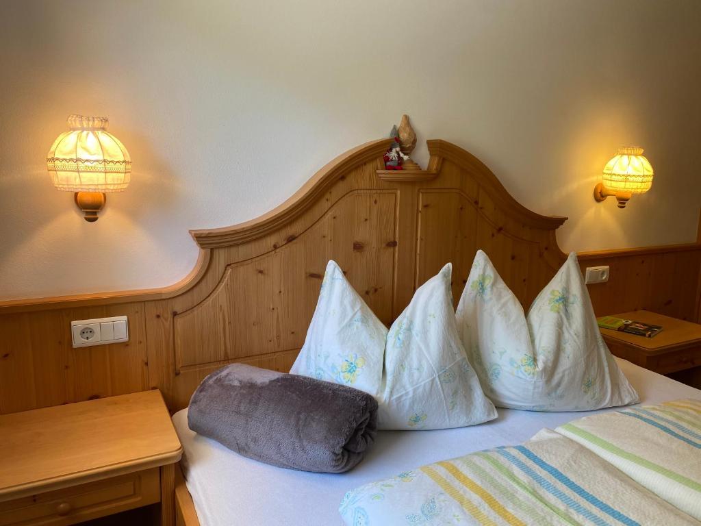 Un pat sau paturi într-o cameră la Planitzhof