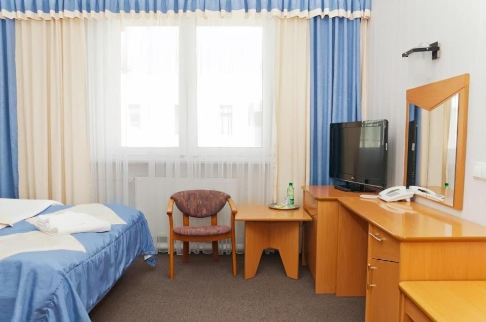 Łóżko lub łóżka w pokoju w obiekcie Vistula Hotel