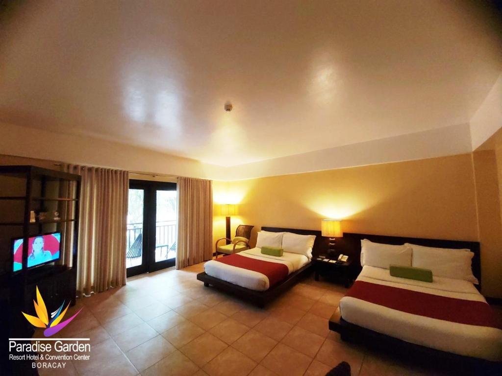 Voodi või voodid majutusasutuse Paradise Garden Hotel and Convention Center Boracay Powered by ASTON toas