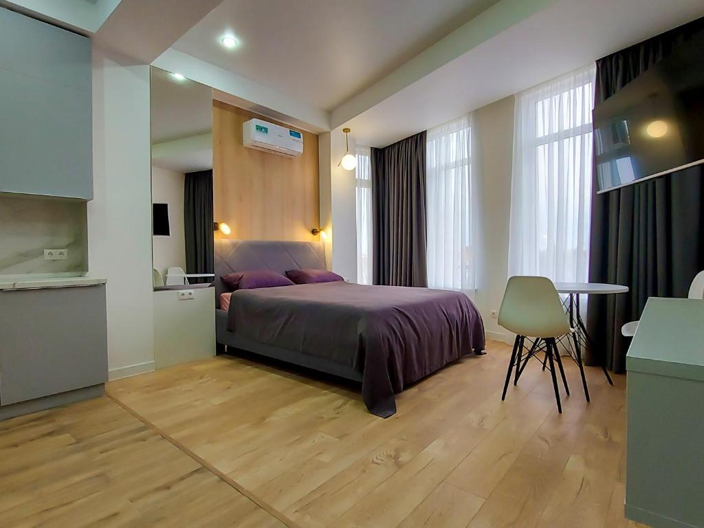 Ένα ή περισσότερα κρεβάτια σε δωμάτιο στο "Имеретинские курорты", апартаментный комплекс