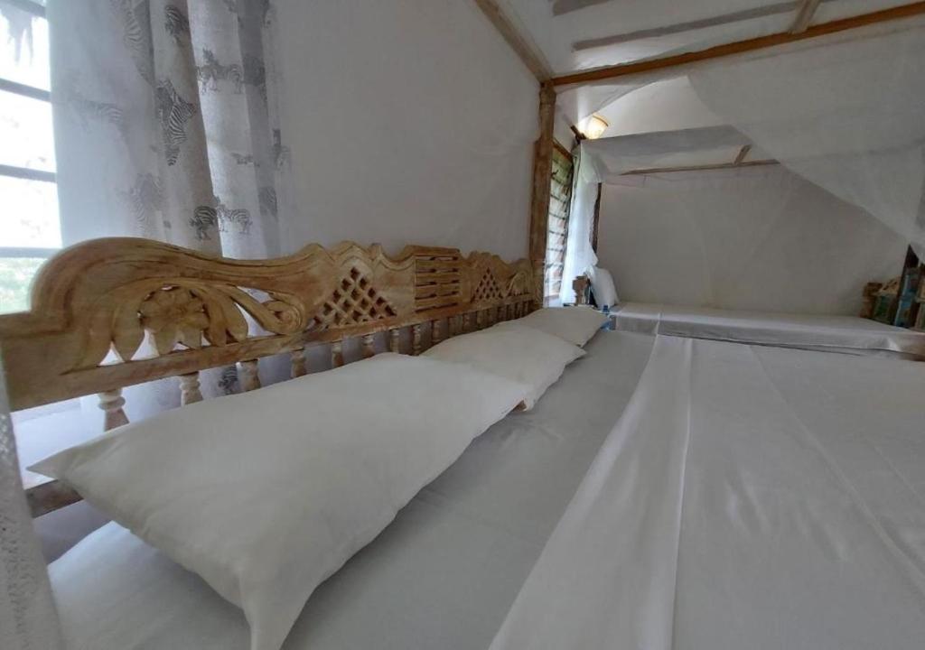 Postel nebo postele na pokoji v ubytování Marine Holiday House