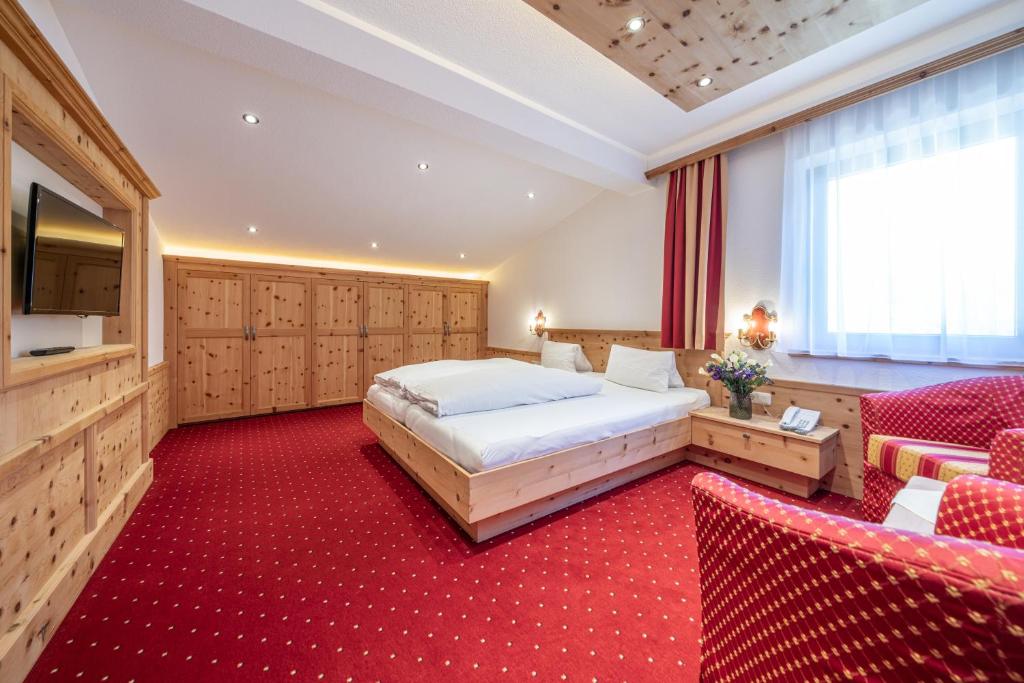 Postel nebo postele na pokoji v ubytování Hotel Similaun