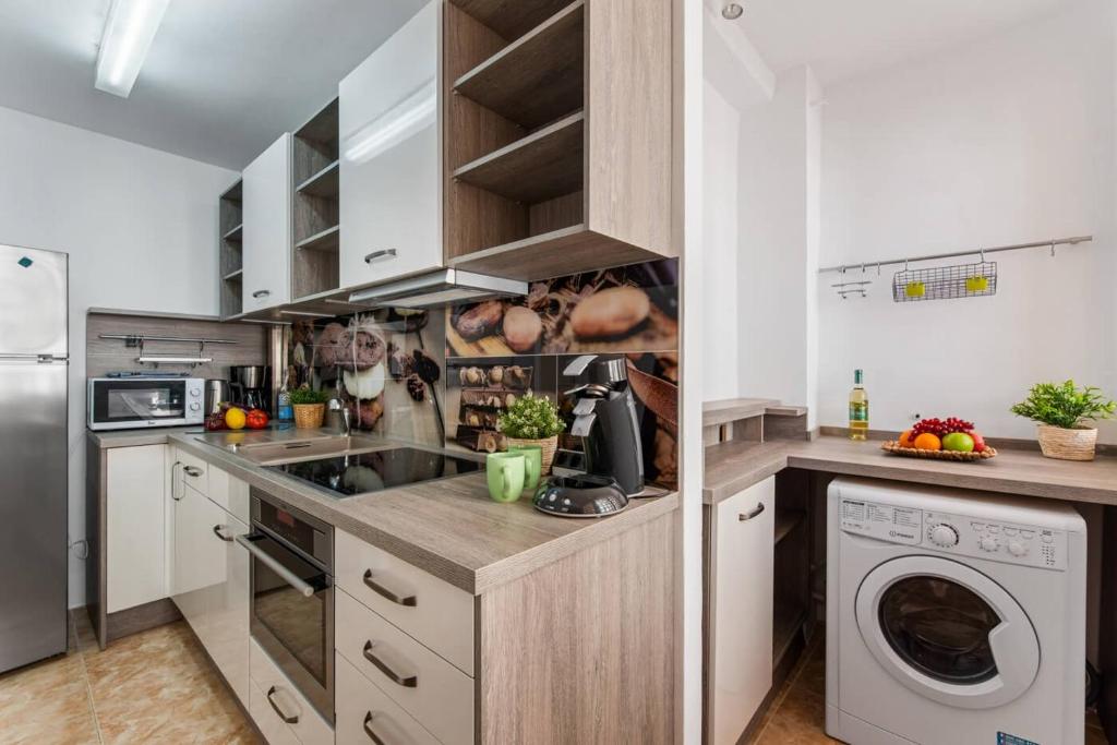 Kuchyň nebo kuchyňský kout v ubytování Apartment Penyon - PlusHolidays