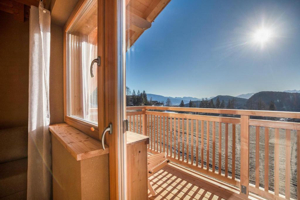 a balcony with a view of the mountains at Brugghof Apartement Lärche in San Felice
