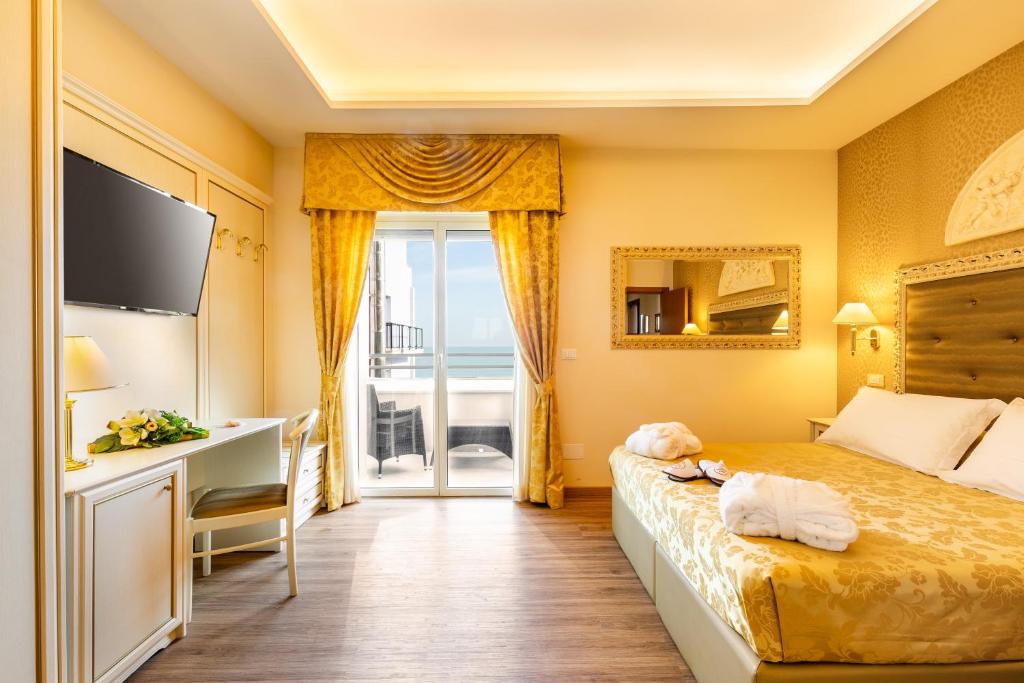 Postel nebo postele na pokoji v ubytování Hotel Mazzanti