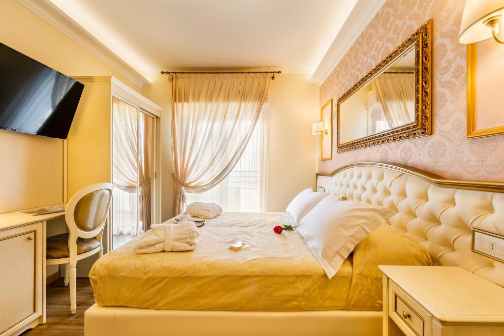 Postel nebo postele na pokoji v ubytování Hotel Mazzanti
