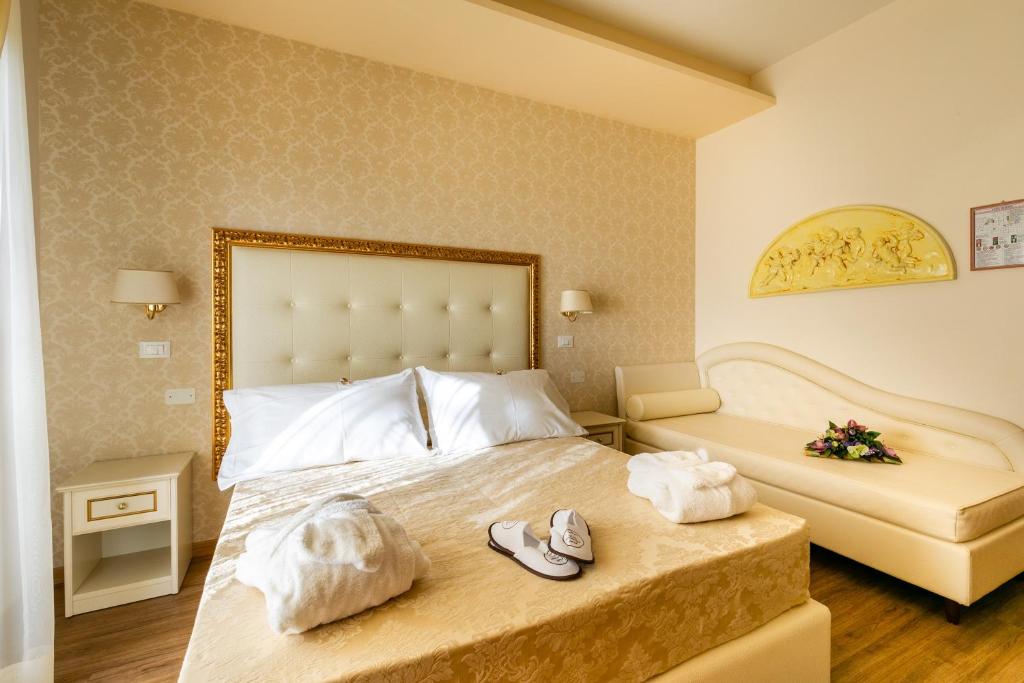 Postel nebo postele na pokoji v ubytování Hotel Mazzanti