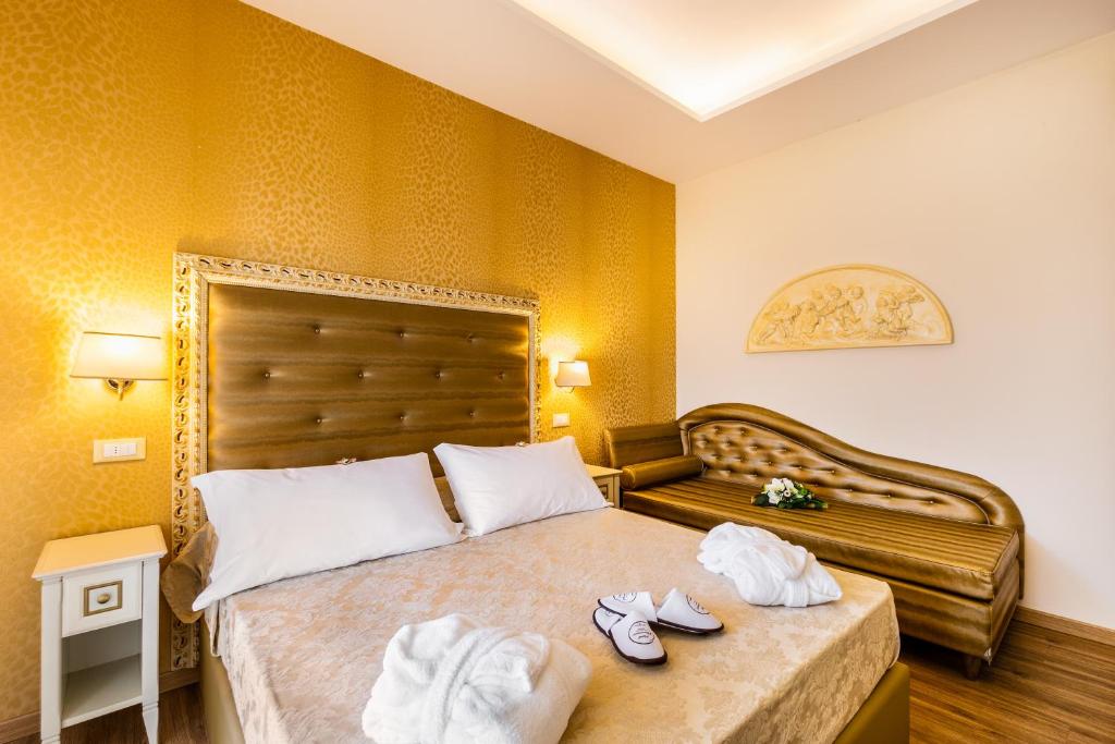 Postel nebo postele na pokoji v ubytování Hotel Mazzanti